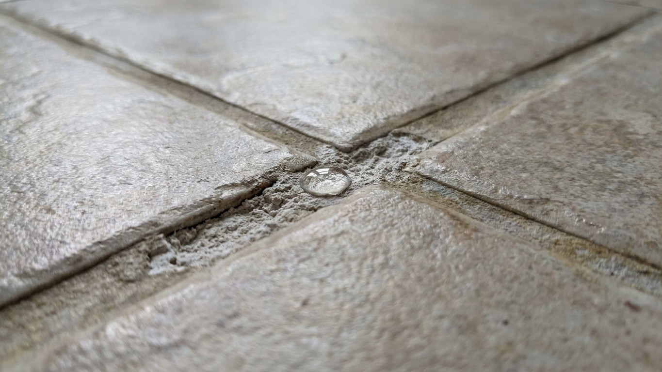 I poured neat white vinegar on my bathroom grout every week just to whiten it: two years on, I understood why the dirt was...