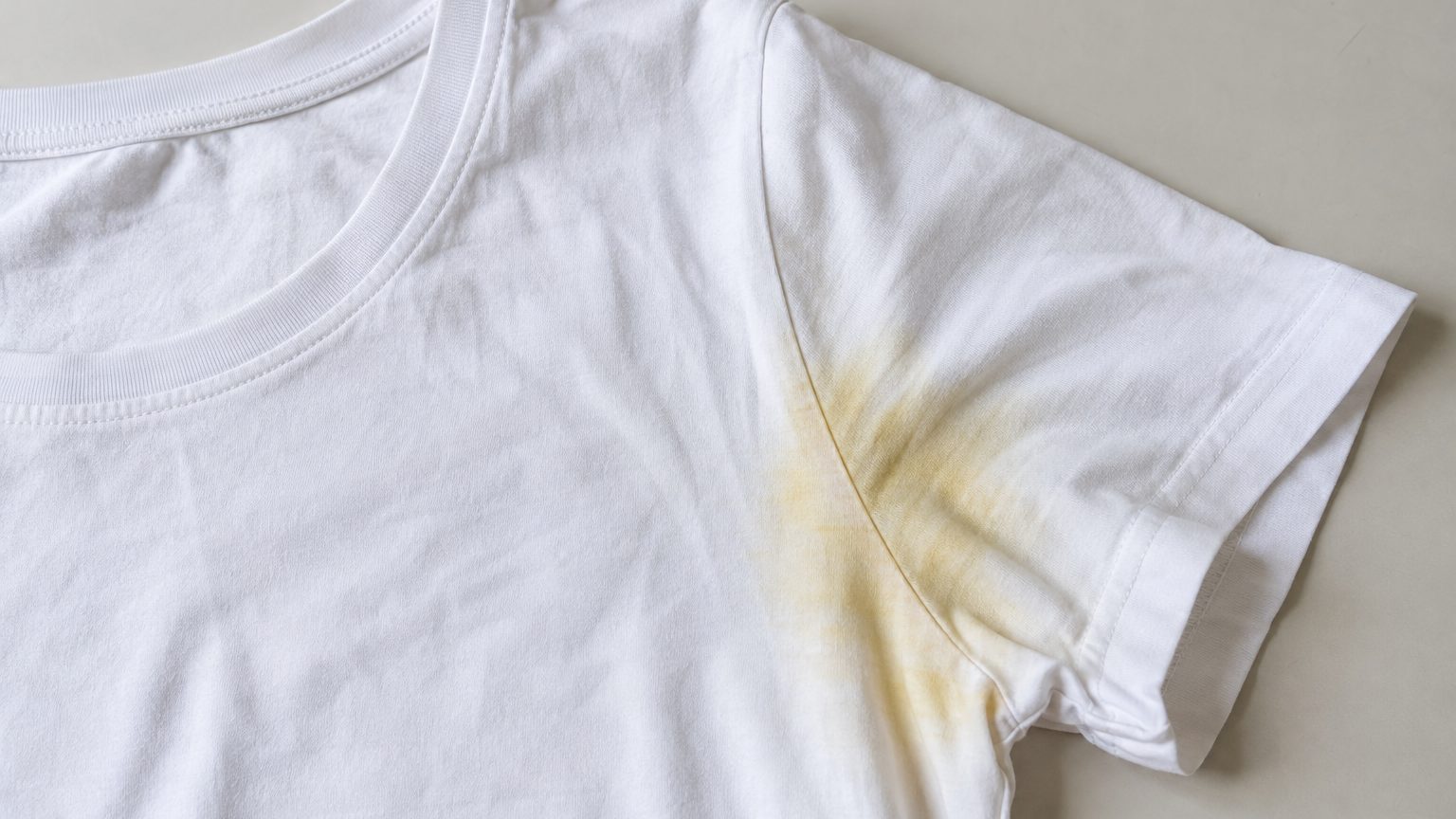 Why does my deodorant leave yellow stains on shirts? The aluminium-sweat reaction and how to stop it
